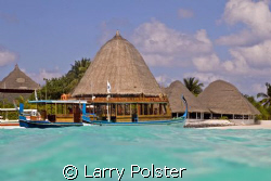 Beautiful waters of Angaga Island by Larry Polster 